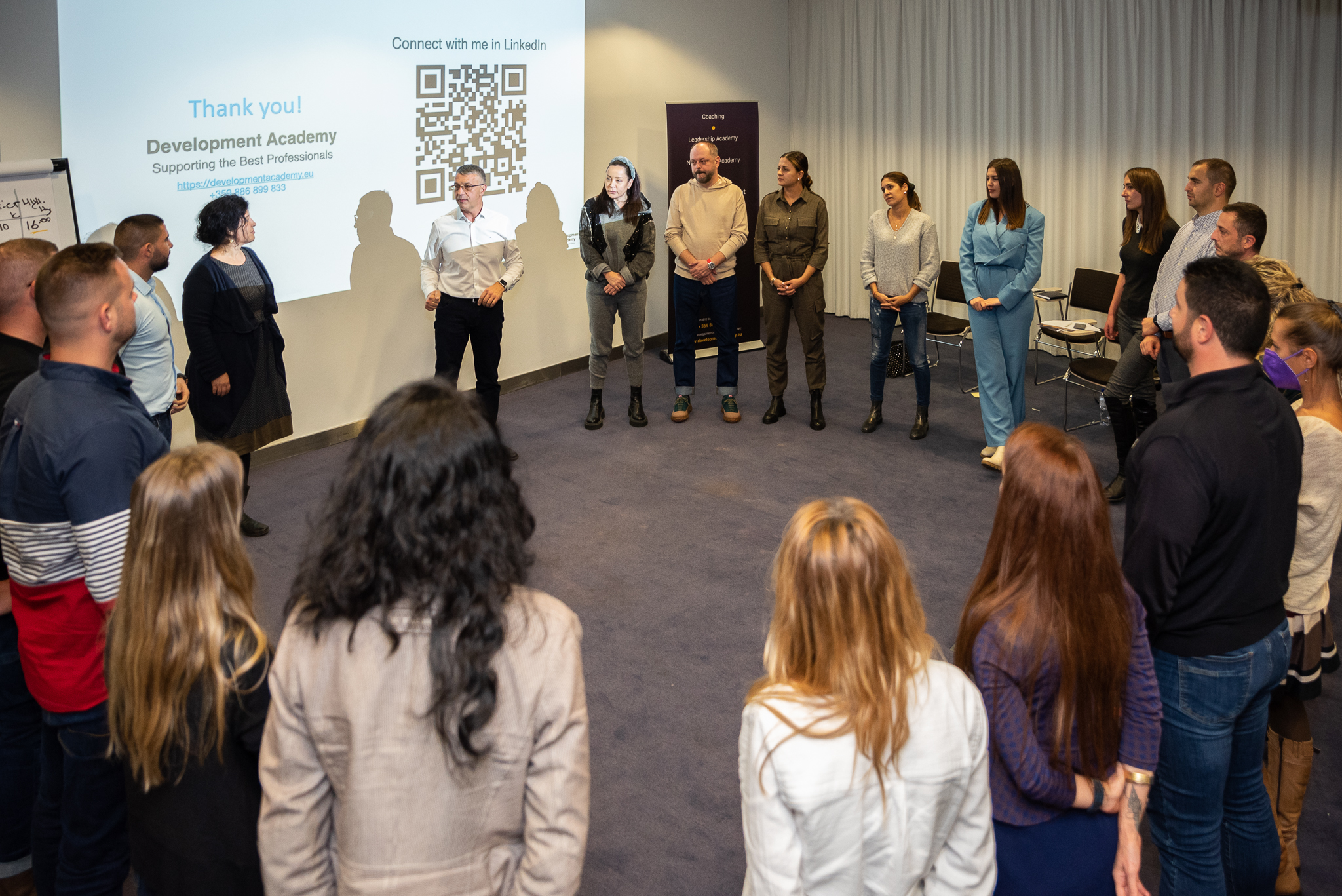 People in circle attending Master Negotiations seminar